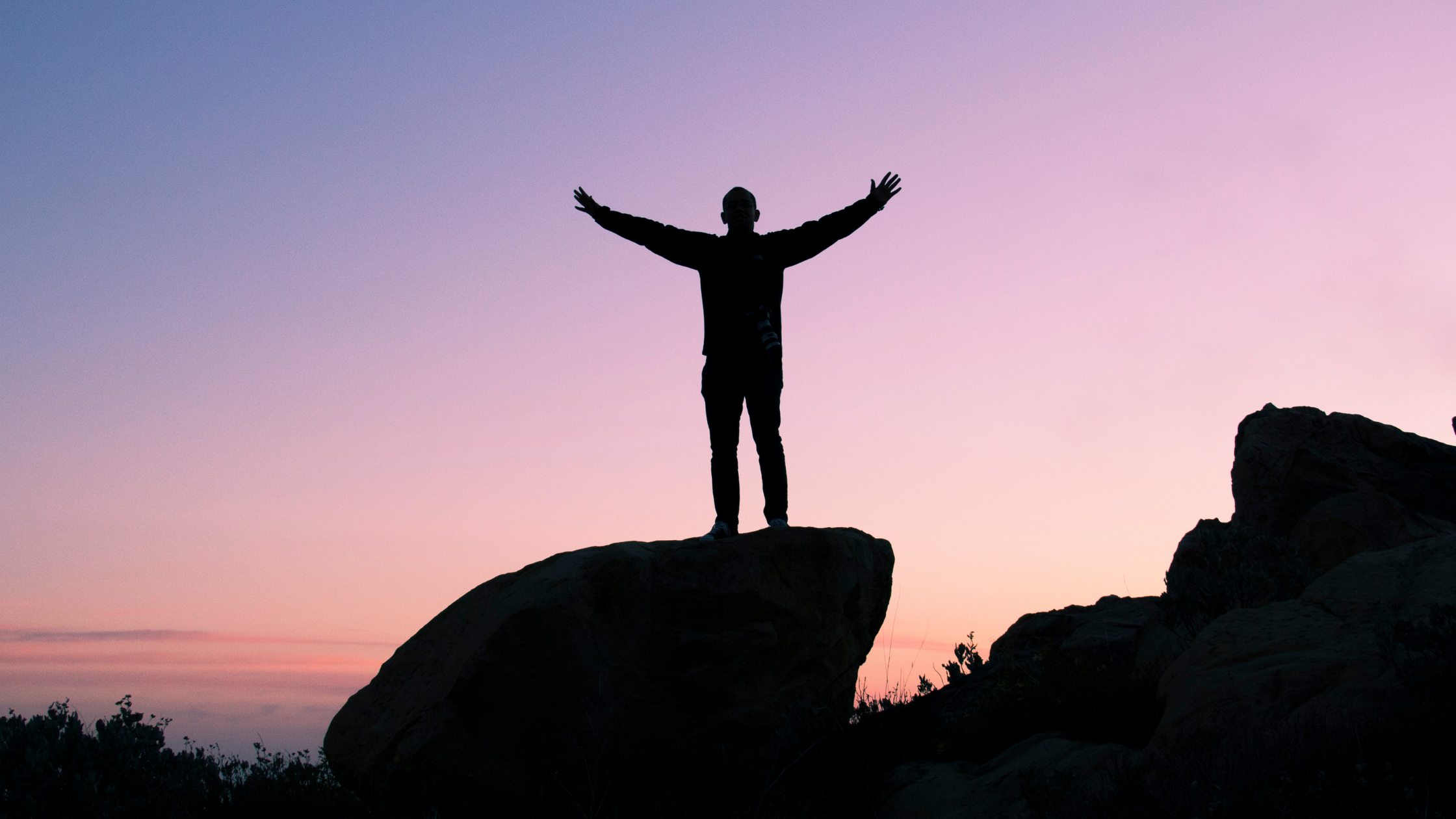 A man on top of a rock